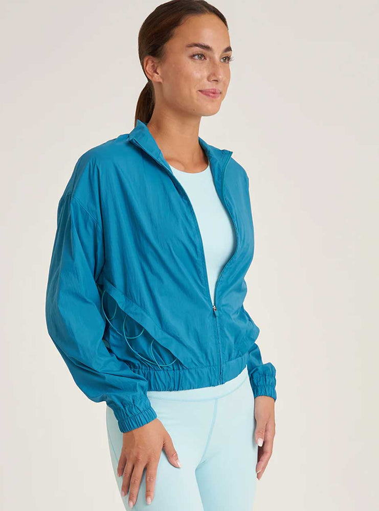 
                  
                    Thrive Société Women's Packable Bungee Windbreaker Jacket -  Caribbean Blue
                  
                